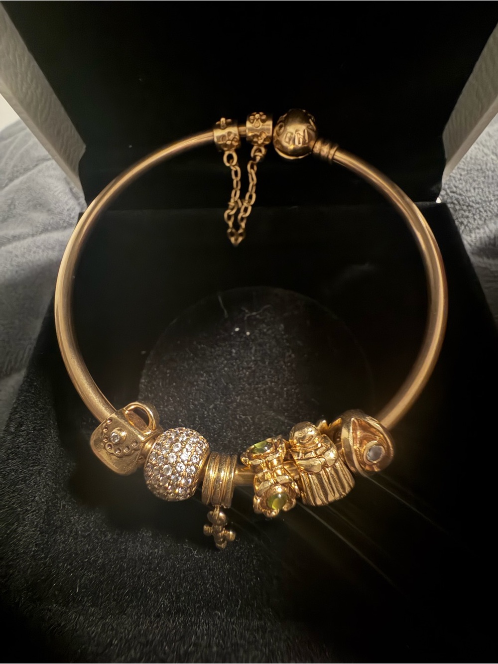 Pandora 14k gold bangle with charms and safety chain